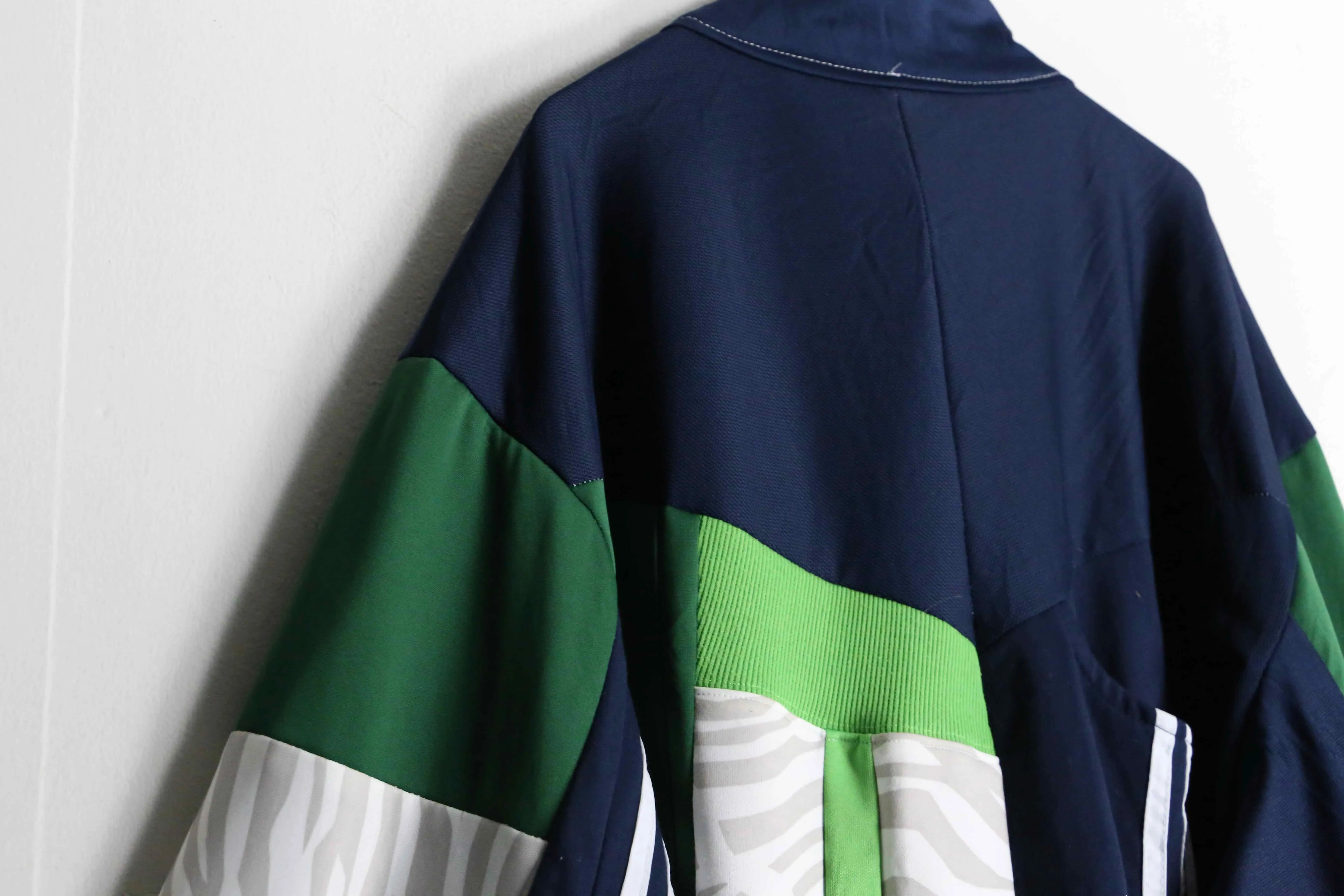 "Re:make"green × navy color random track jacket